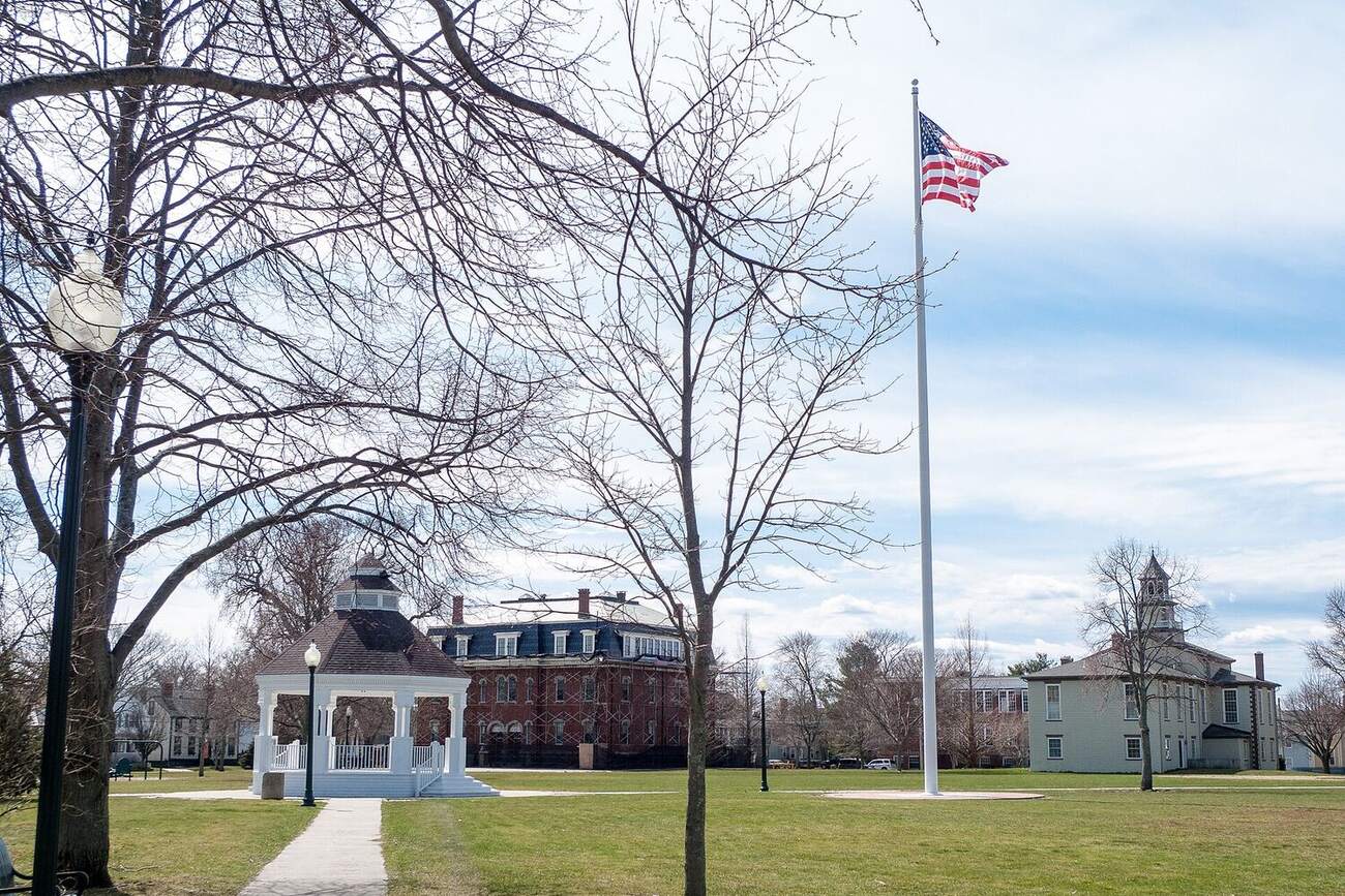 A town common with a gazebo and flagpole